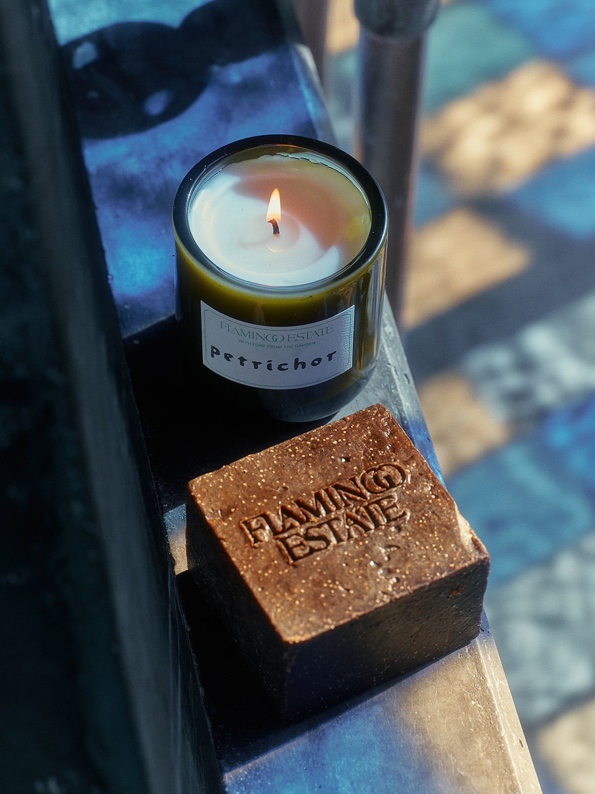 A lit candle labeled 