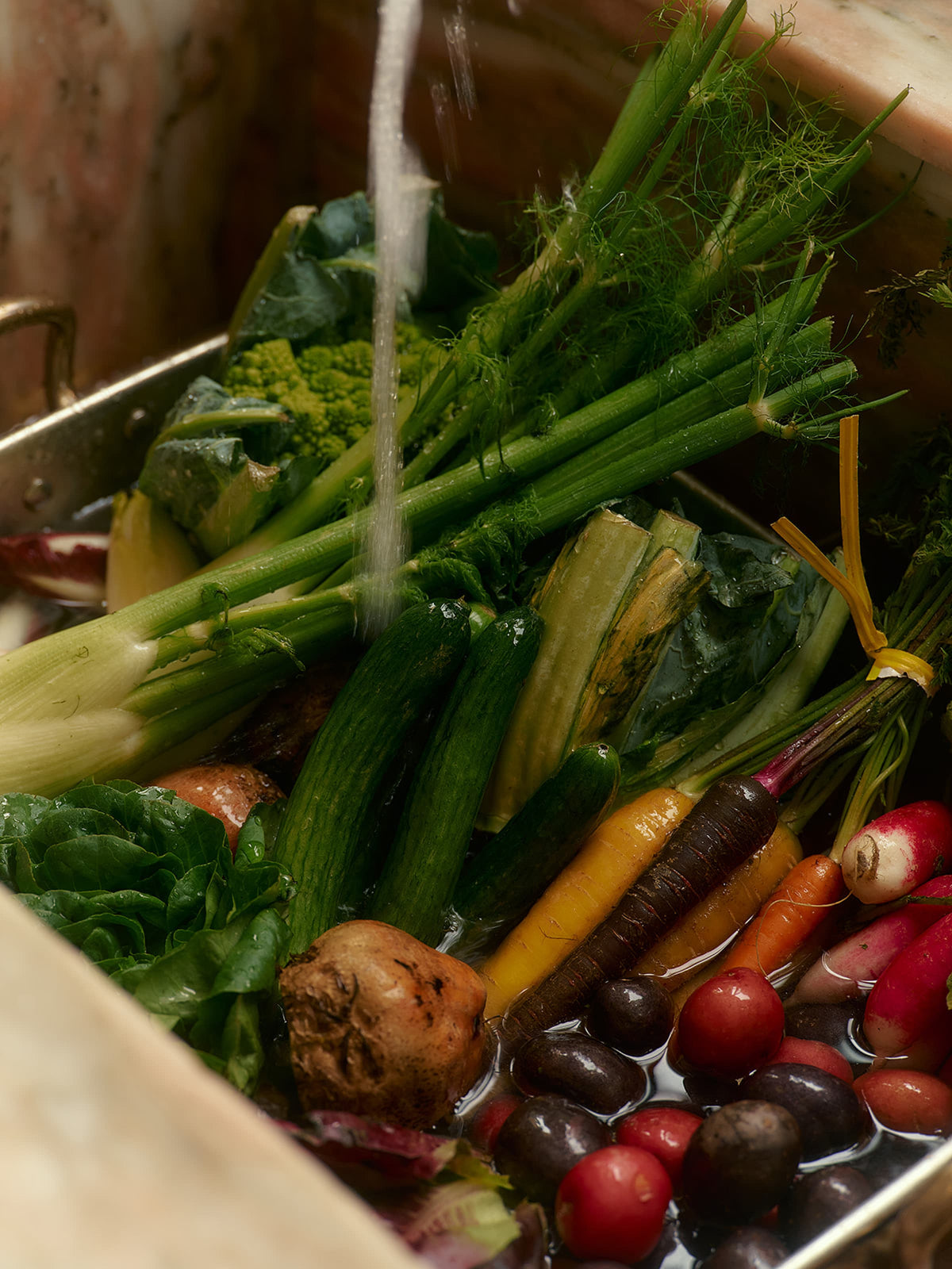 Fresh Produce Being Washed in A Sink