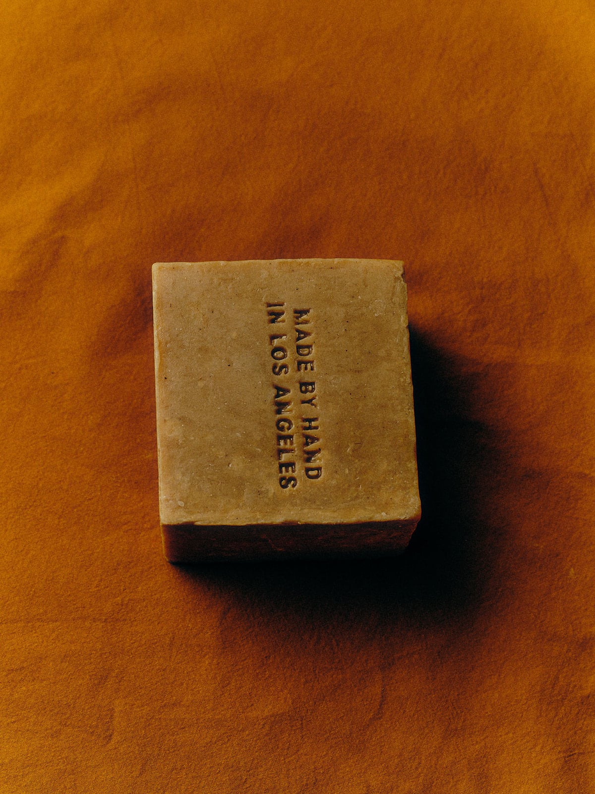 A handmade bar of soap with the text 