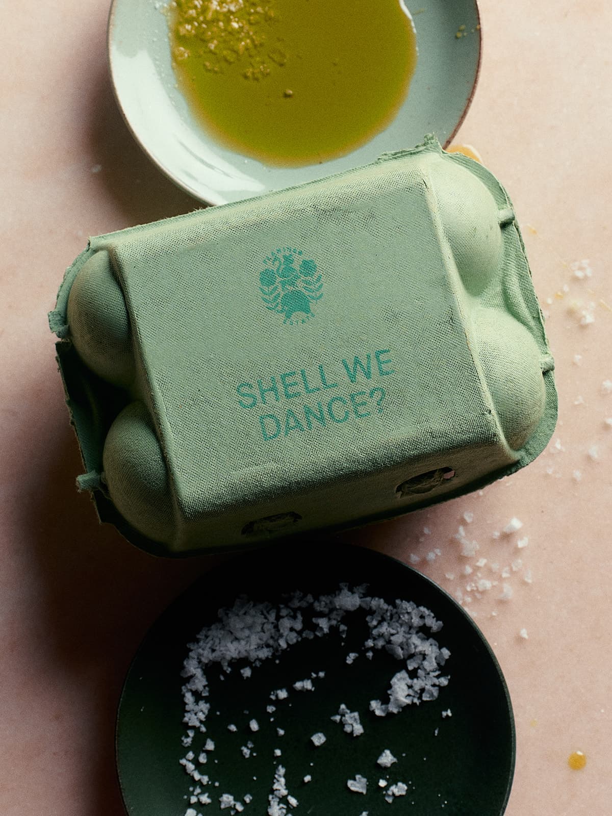 A green egg carton labeled 