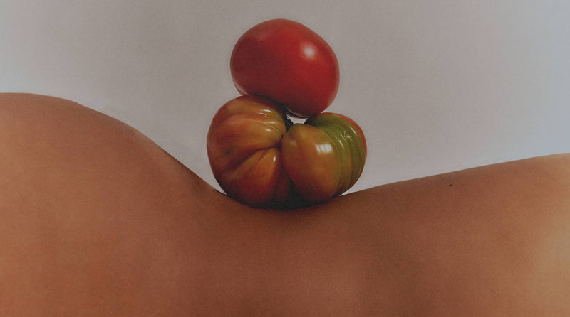 Tomatoes Balanced On Someone's Body