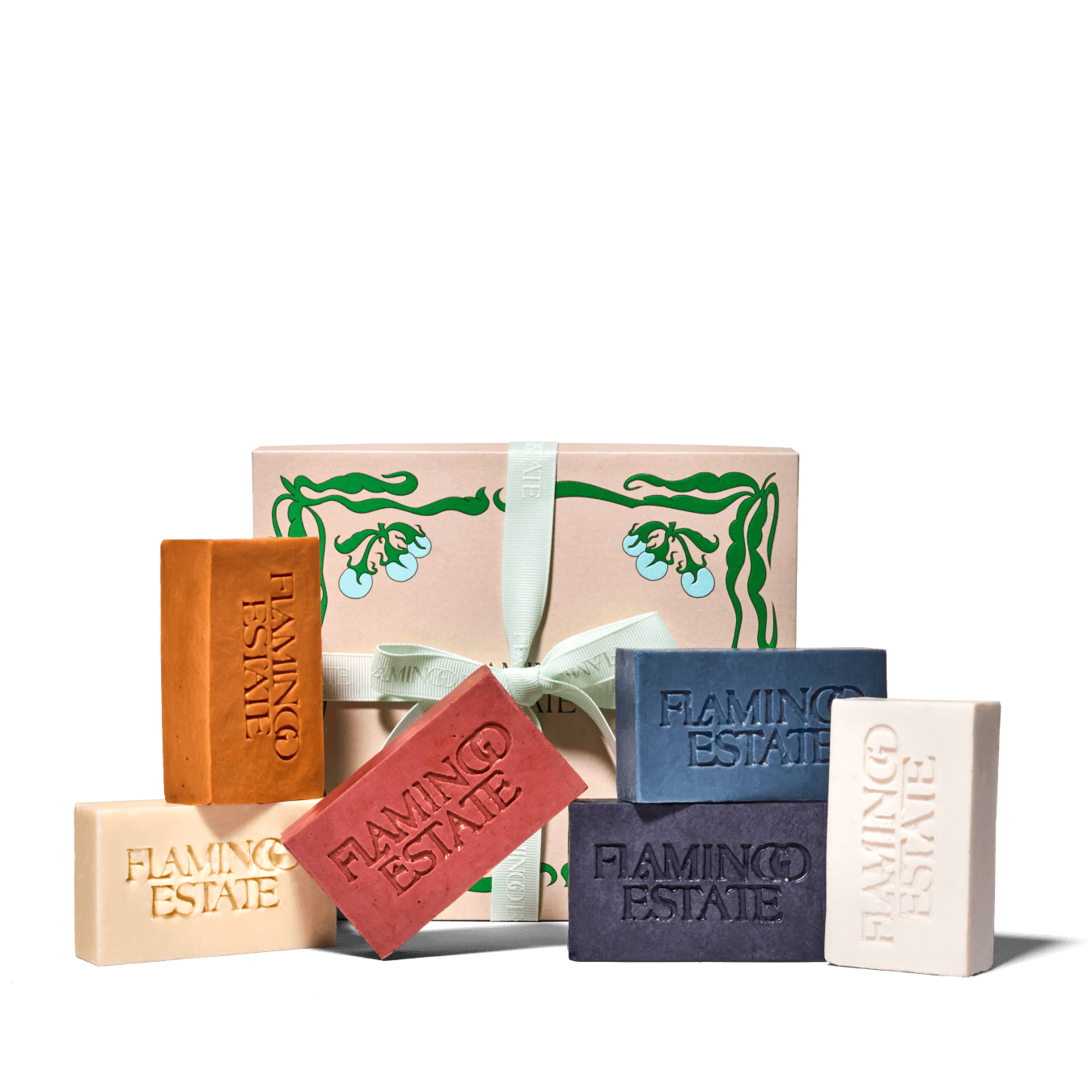 Colorful Blocks Of Flamingo Estate Soaps Presented in Front of Pink Packaging Box