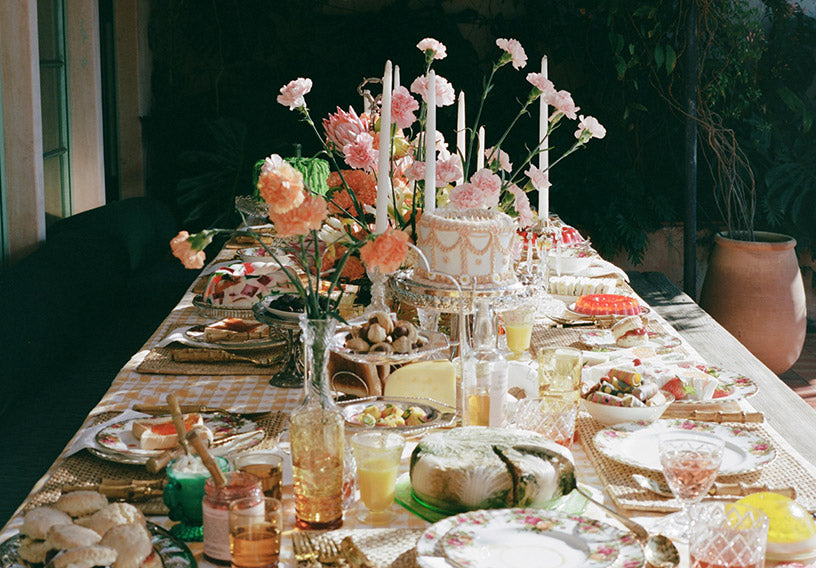 Set Table With Cakes, Sweet Treats, Flowers And Drinks