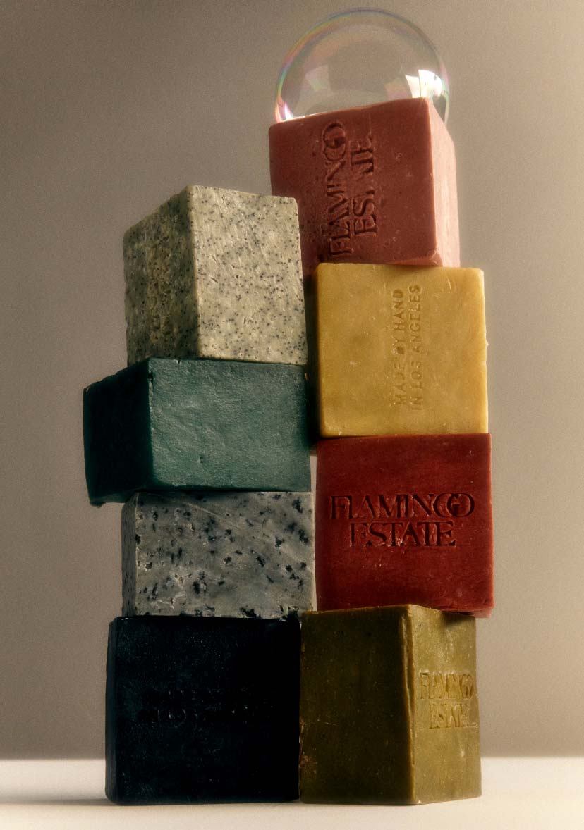 Two Stacks Of Colorful Flamingo Estate Soap Bricks