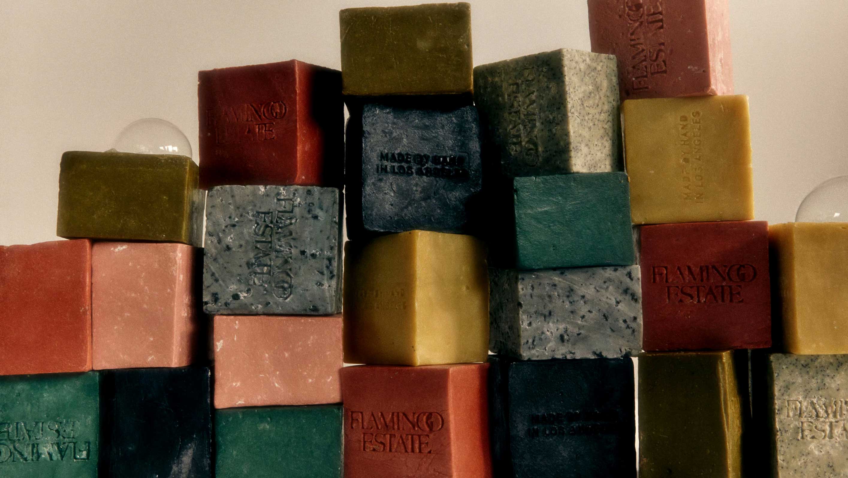 Stacks Of Colorful Flamingo Estate Soap Bricks